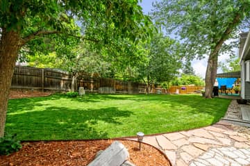 This yard has had a major transformation from when it was purchased ~ Just the right amount of shade and sunshine...All yours to enjoy!