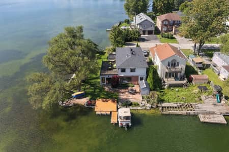 Aerial shoreline view of 3 Willowbank Avenue with dock and lake access