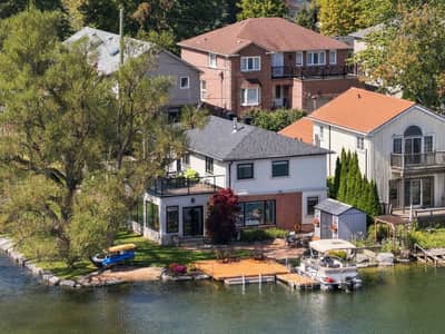 Rear waterfront elevation of 3 Willowbank Avenue with dock and outdoor living