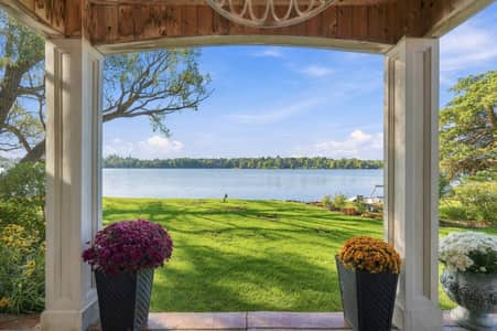 Covered porch at 3 Willowbank Avenue framing Lake Wilcox